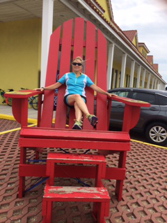Sitting in big red chair